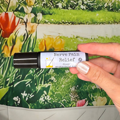 Hand holding a bottle labeled 'Nerve Pain Relief' against a floral background